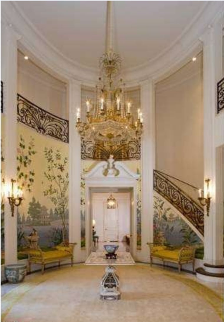 The 10-bedroom Neff estate measures 15,520 square feet and opens to a grand entry with hand-painted wallpaper.