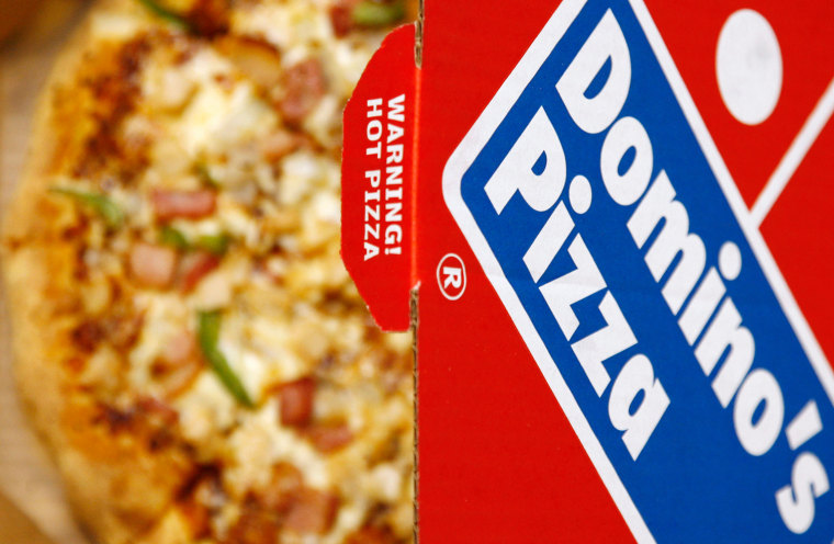 A Domino's Pizza is pictured in its box in central London, February 15, 2009. Britain's biggest pizza delivery chain Domino's Pizza reported a 25 per...