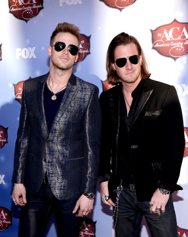LAS VEGAS, NV - DECEMBER 10:  Recording artists Tyler Hubbard (R) and Brian Kelley of Florida Georgia Line arrive at the 2013 American Country Awards ...