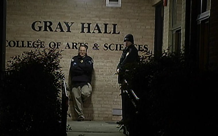 Authorities stand outside Gray Hall on the American University campus in Washington, D.C., on Wednesday.