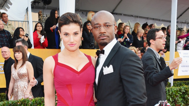 LOS ANGELES, CA - JANUARY 27:  Actors Idina Menzel and Taye Diggs arrive at the 19th Annual Screen Actors Guild Awards held at The Shrine Auditorium o...