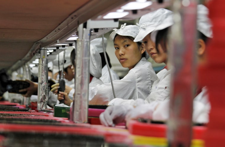 Workers are seen inside a Foxconn factory in the township of Longhua in the southern Guangdong province, in this file picture taken May 26, 2010. In a...