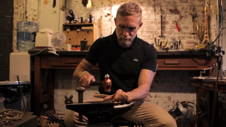 Artist Philip Crangi works on pieces for the Liberty United line in his studio.