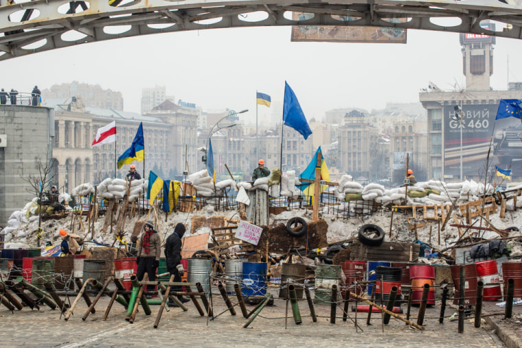 Anti-government protesters in Ukraine fortify barricades intended to block the police from forcing them out of Independence Square in the capital, Kiev.