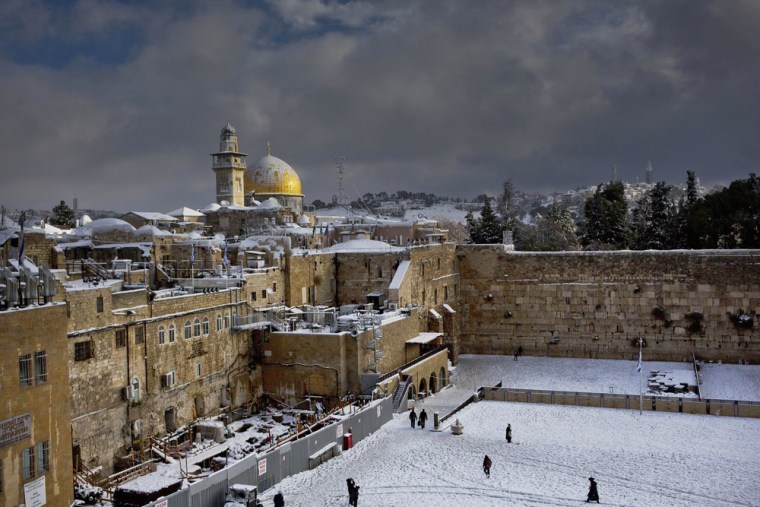 The Western Wall and the Dome of the Rock are covered in snow in Jerusalem on Dec. 13, 2013. Early snow has surprised many Israelis and Palestinians as a blustery storm, dubbed Alexa, brought gusty winds, torrential rains and heavy snowfall to parts of the Middle East.
