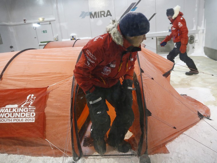 Britain's Prince Harry leaves his tent during a cold chamber training exercise with the Walking with the Wounded South Pole Allied Challenge 2013 Brit...