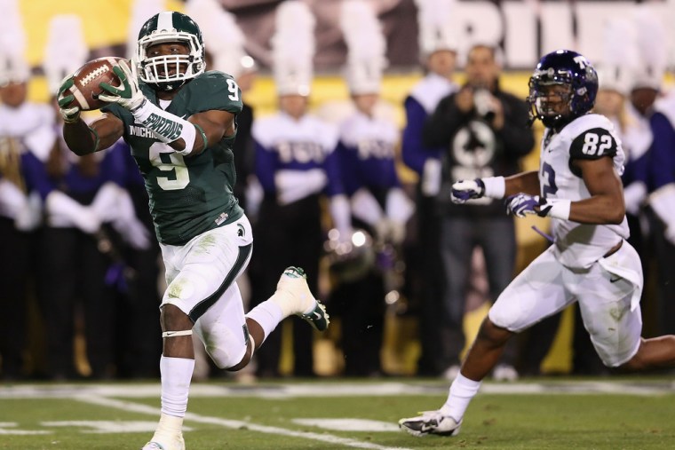 Safety Isaiah Lewis #9 of the Michigan State Spartans intercepts a second quarter pass during the Buffalo Wild Wings Bowl against the TCU Horned Frogs...