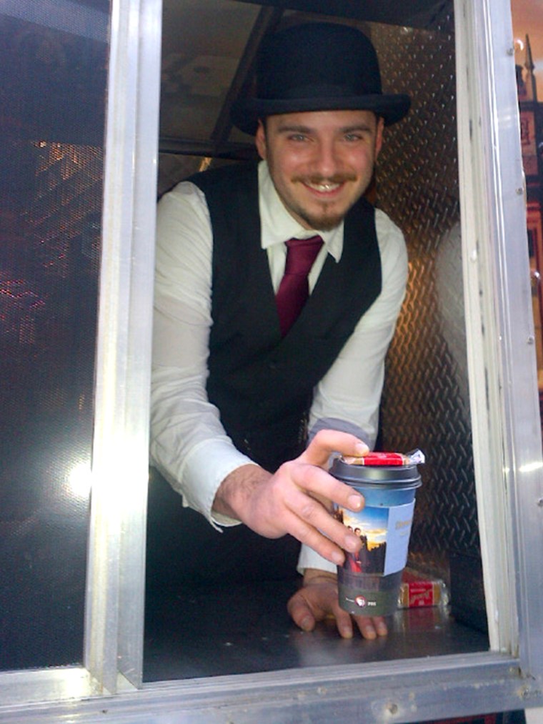 A server dressed in his Downton finest hands out tea from the NYC truck.