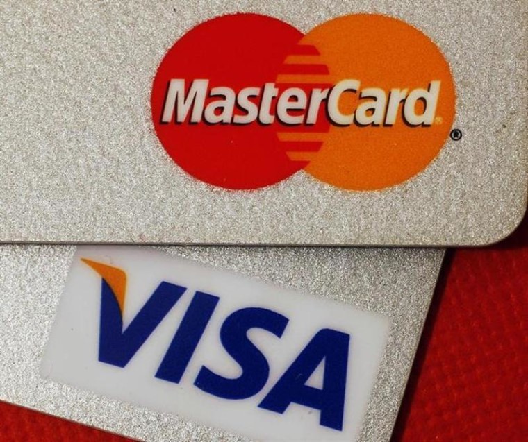 A judge approved a class-action settlement between merchants and MasterCard and VISA over transaction fees. But some merchants dropped out of the case in opposition.