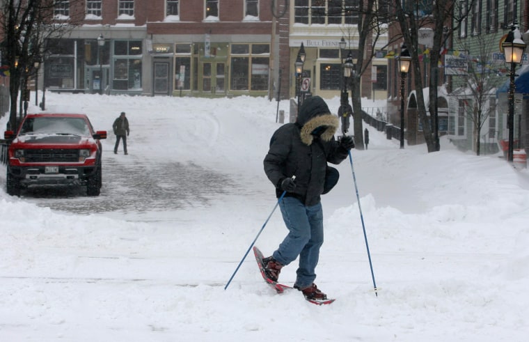 Jason Gallant snowshoes to work after a snowstorm in Portland, Maine, on Dec. 15.