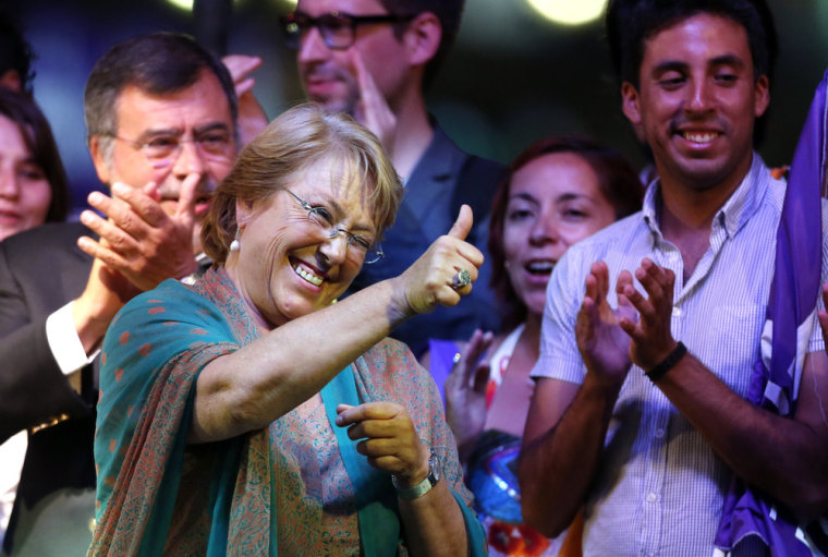 Presidential candidate and former President Michelle Bachelet gives the thumbs up sign during a victory rally in Santiago, Chile, Sunday, Dec. 15, 2013.