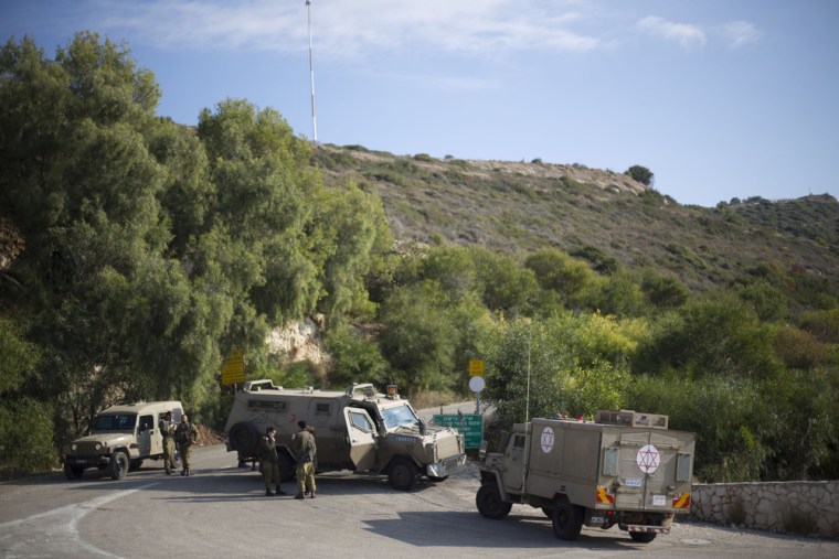 Israeli soldiers guard near the border between northern Israel and Lebanon on Monday.