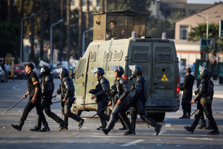 Egyptian riot police move to disperse students and supporters of the country's ousted Islamist president after they rallied outside a Cairo university in November.