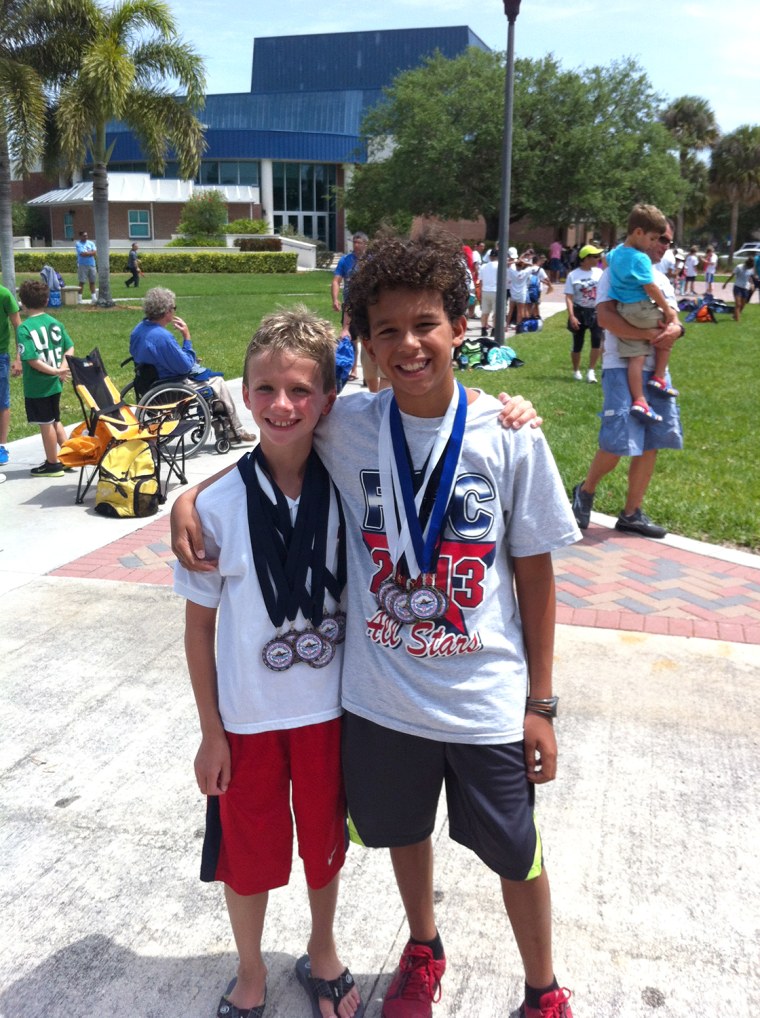 Florida swimmer Josh Zuchowski, 9, (at left) gave his trophy as the top swimmer in a meet earlier this month to rival Reese Branzell, 10, (at right) after Branzell had been hospitalized and could not compete.