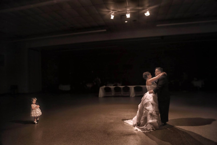 The couple dances at their wedding.