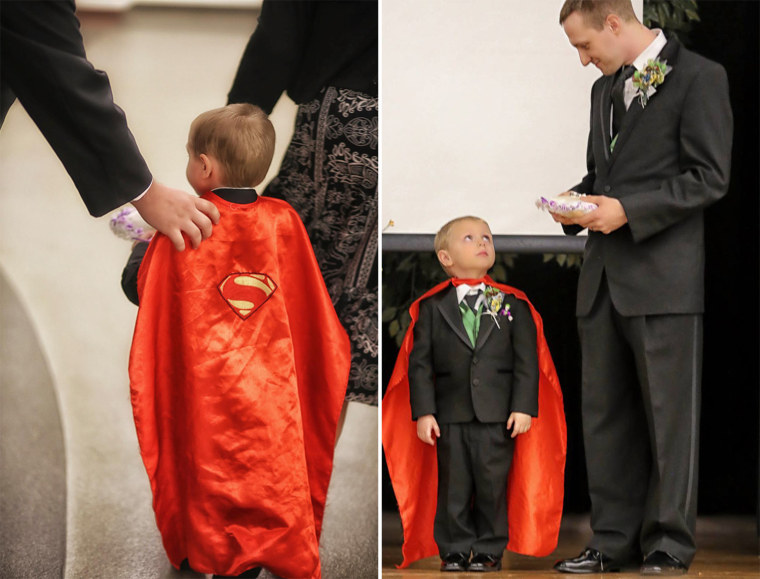 The couple's son Kal-El, in a superhero cape.
