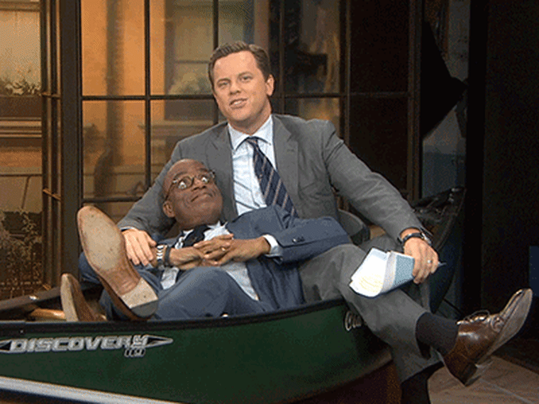 Al Roker and Willie Geist in a canoe.