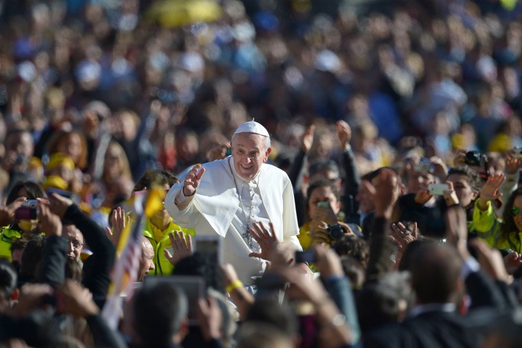 Pope Francis salutes the crowd as he arrives for his general audience in St. Peter's Square on Nov. 6.
