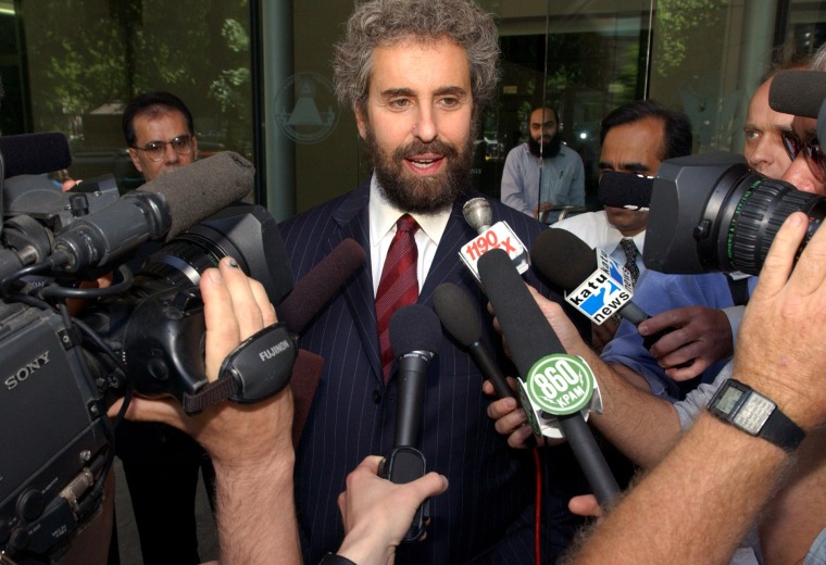 Stanley Cohen, center, attorney for Mohamed Kariye, speaks to reporters on the steps of the Federal Courthouse in Portland, Ore., in 2003. Kariye was arrested after traces of explosives allegedly were found on his clothing as he boarded an airplane. The charges were dismissed, but Kariye pleaded guilty to making false statements in applying for state health insurance benefits and to Social Security fraud.