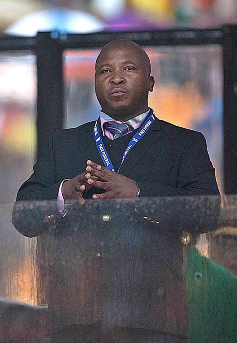 Thamsanqa Jantjie stands during US President Barack Obama's speech at the Nelson Mandela Memorial at FBN Stadium, Johannesburg, South Africa, December 10.