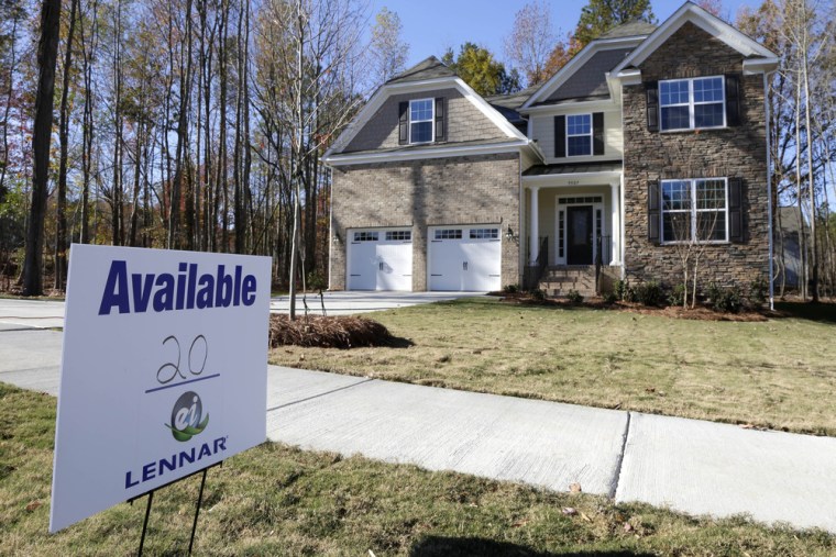 Home resales dropped, hurt by a rise in interest rates, according to the National Association of Realtors.