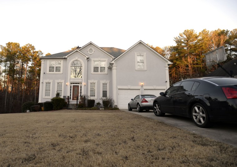 Dusk falls on the home listed for Ira Curry, one of two Mega Millions lottery ticket winners that were identified by lottery officials in the $636 million drawing on Wednesday, in Stone Mountain, Ga.