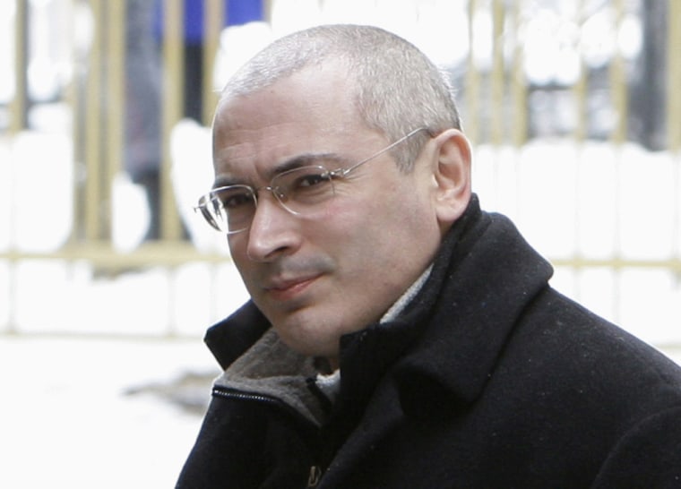 Former Yukos chief Mikhail Khodorkovsky arrives at a court building in Moscow in this March 3, 2009 file photo. President Vladimir Putin announced Thursday he will pardon Khodorkovsky, one of his best known opponents