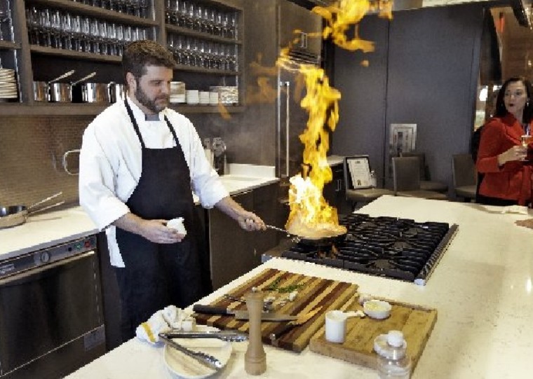 Executive Chef Chad Johnson cooks a steak Dec. 17 during a tour of the new Epicurean Hotel in Tampa, Fla.