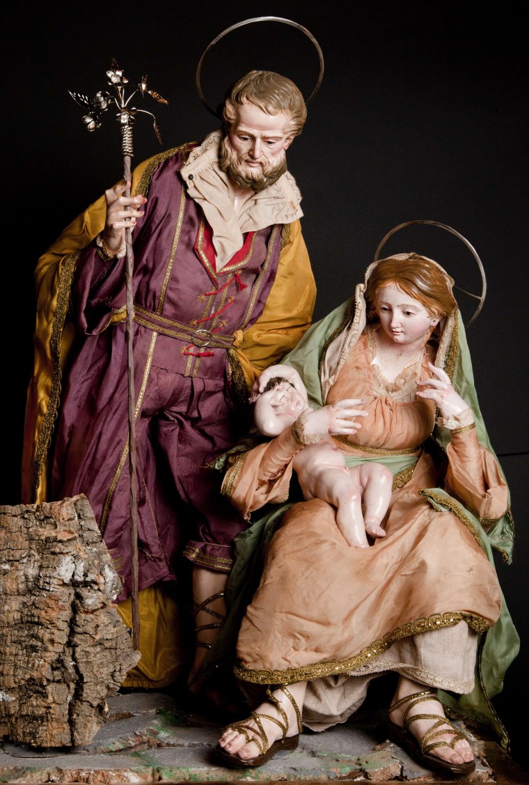 A picture shows a crib figurine representing a nativity scene at the Cantone & Costabile shop Via San Gregorio Armeno, a narrow street often called th...