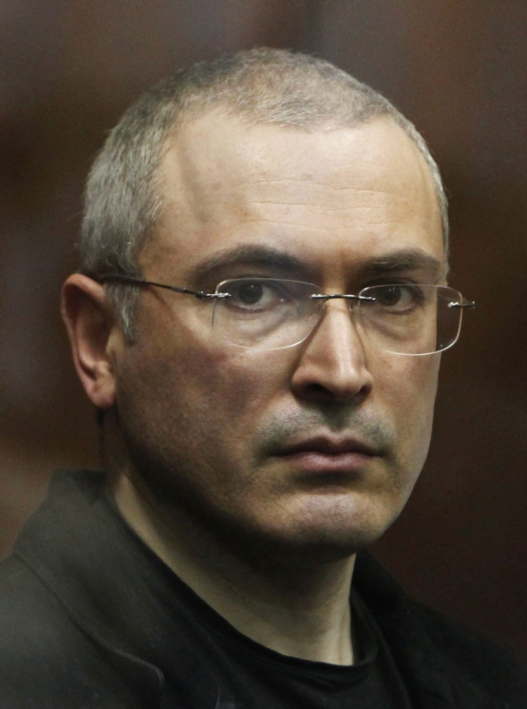 Jailed Russian former oil tycoon Mikhail Khodorkovsky stands in the defendants' cage in a Moscow on Dec. 30, 2010.