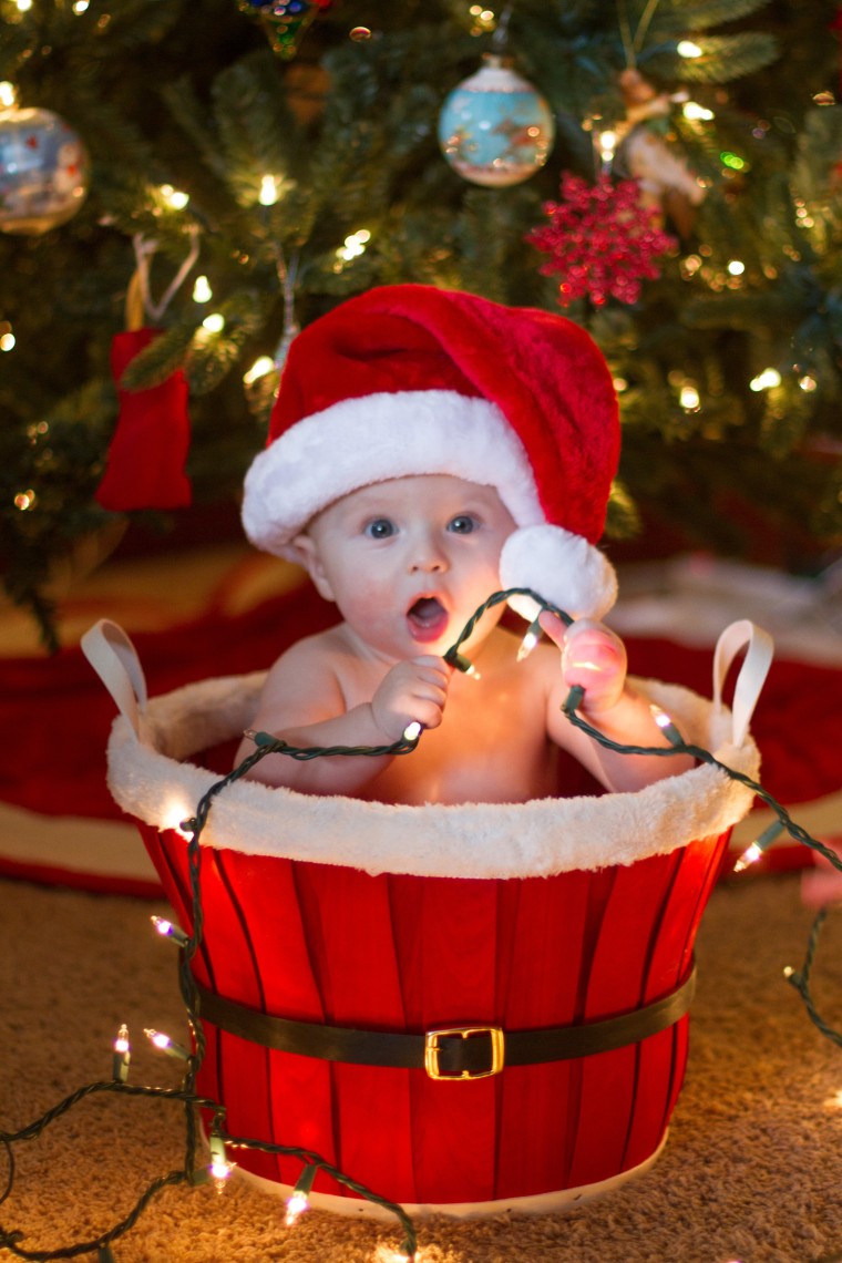 Brayden James, born Apr. 13, helps his parents light up the holidays.