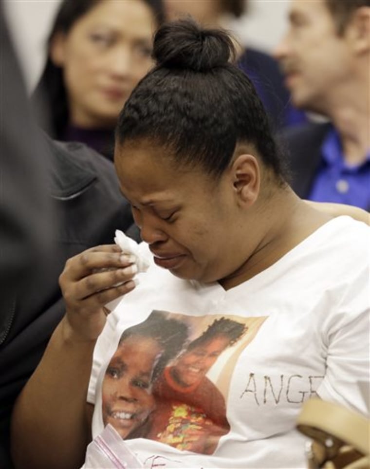 Nailah Winkfield, mother of Jahi McMath, cries before a courtroom hearing regarding the girl on Friday in Oakland, Calif.