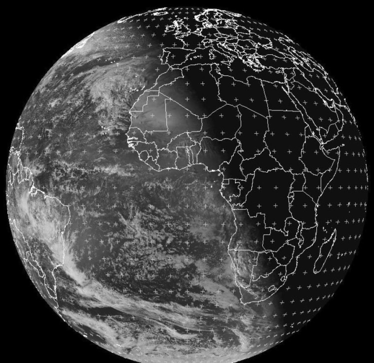 A black-and-white photo from the EUMETSAT weather satellite shows Earth's terminator line at noon ET, just before the December solstice. The slanting line shows that the Southern Hemisphere receives more sunlight than the Northern Hemisphere in December, due to our planet's tilt.