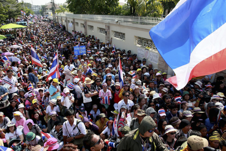 Thai anti-government protesters gather outside Prime Minister Yingluck Shinawatra's residence on Sunday.