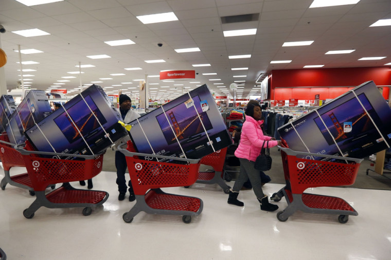 Thanksgiving Day holiday shoppers line up with television sets on discount at the Target retail store in Chicago, Illinois in this November 28, 2013 f...