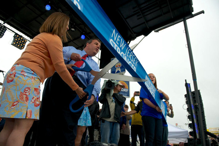 New Jersey Gov. Chris Christie cuts a ribbon more than five miles long at the Memorial Day Weekend re-opening ceremony of the Jersey Shore.