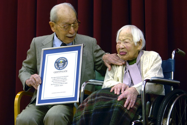 Misao Okawa is joined by her 90-year-old son, Hiroshi