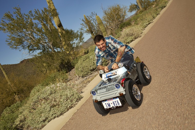 Austin Coulson, the Guinness record holder for 'Smallest Roadworthy Car.'