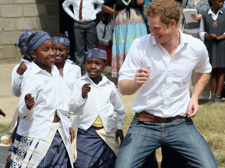 MASERU, LESOTHO - FEBRUARY 27: Prince Harry dances with deaf children during at visit to the Kananelo Centre for the deaf, a project supported by his ...