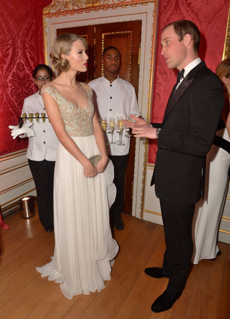 LONDON, ENGLAND - NOVEMBER 26:  Prince William, Duke of Cambridge meets singer Taylor Swift at Kensington Palace for the Centrepoint Winter Whites Gal...