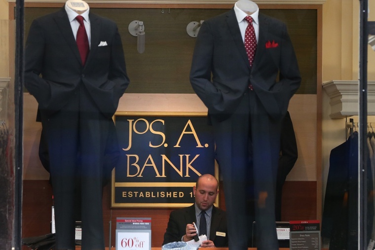 An employee works inside a Jos. A. Bank retail store on December 5, 2013 in San Francisco, California.