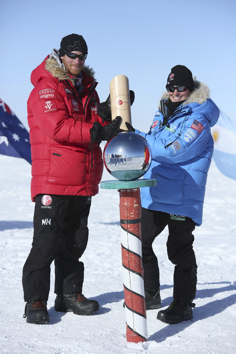 Prince Harry (L) poses for a photograph with Margaux Mange of Team U.S. at the South Pole in this December 13, 2013 handout from Walking With the Woun...