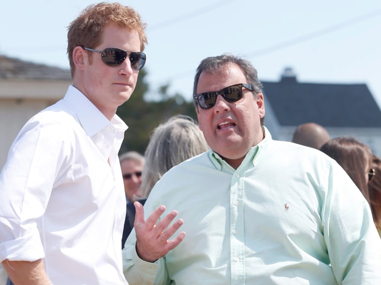 epa03700011 Britain's Prince Harry (L) listens to New Jersey Governor Chris Christie (R) in Mantoloking, New Jersey, USA, 14 May 2013, as the governor...