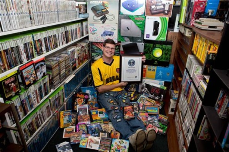 IMAGE: Michael Thomasson and his collection of video games