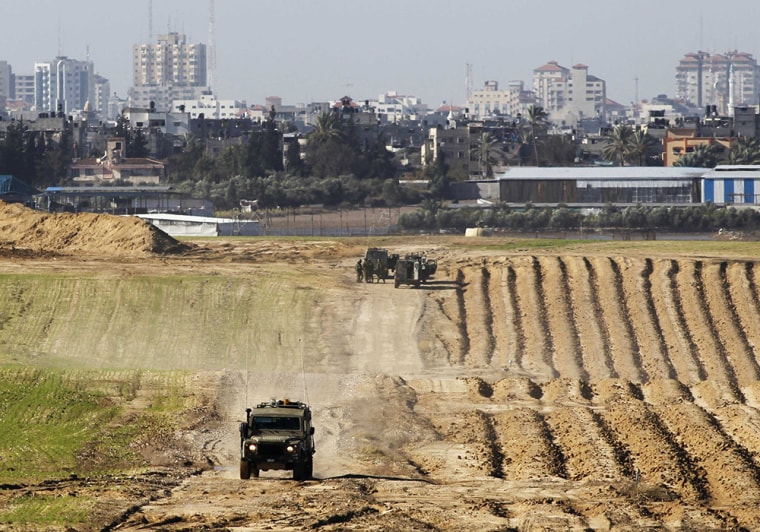 Israeli military jeeps at the scene of the shooting near the border with the northern Gaza Strip, near kibbutz Nahal Oz, on Tuesday.
