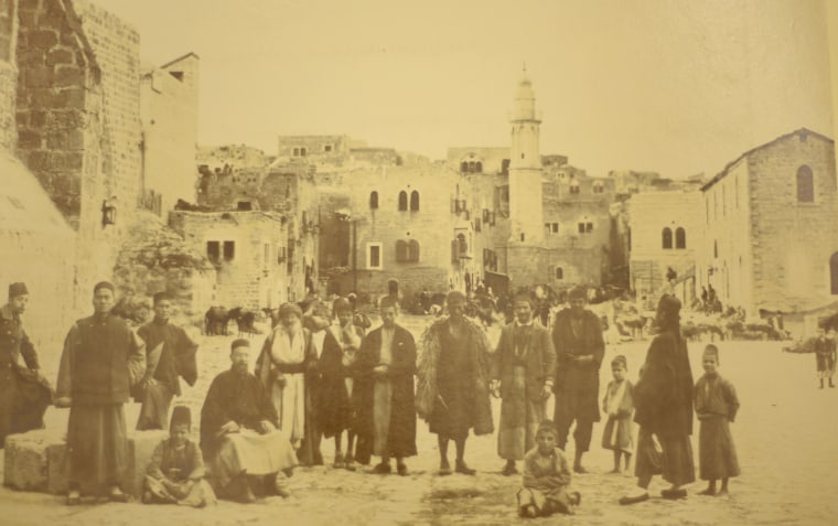 Pilgrims seen in this photograph arrive to Bethlehem during Christmas to visit the Church of the Nativity during the 19th Century.