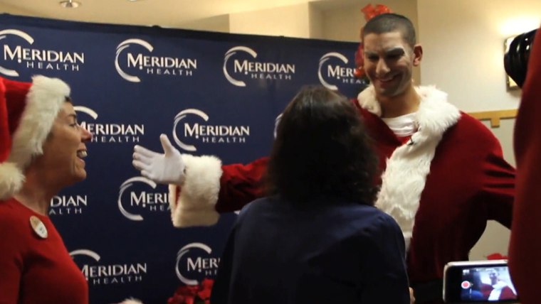 Travis makes the big reveal to his shocked and delighted mom.