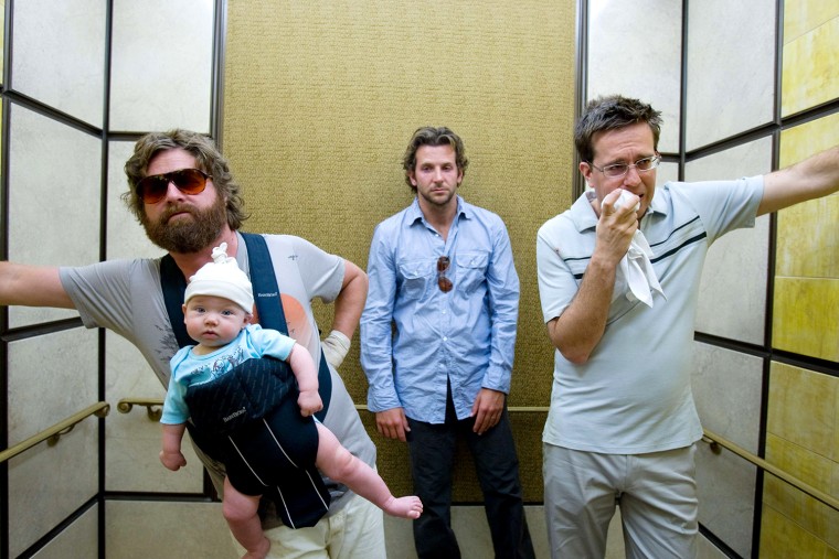 In this film publicity image released by Warner Bros., Zach Galifianakis, left, Bradley Cooper, center, and  Ed Helms are shown in a scene from, \"The ...