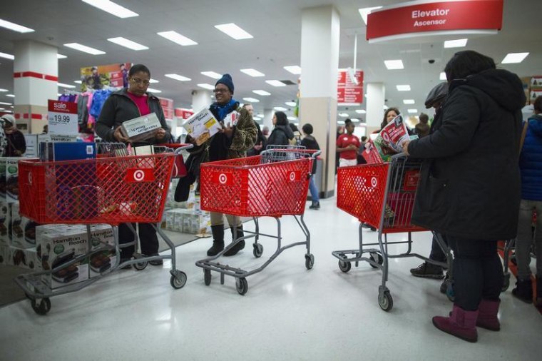 People shop inside a Target store during Black Friday sales in Brooklyn on Nov. 29, 2013. Target confirmed Friday that encrypted PINs were stolen in a breach of payment card data in the first three weeks of the holiday shopping season.