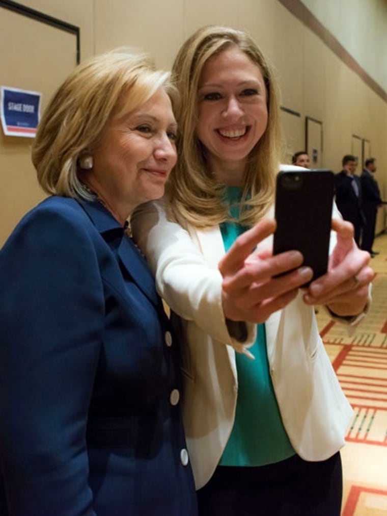This June 14, 2013 photo released by Barbara Kinney shows former Secretary of State Hillary Rodham Clinton, left, posing with her daughter Chelsea at ...